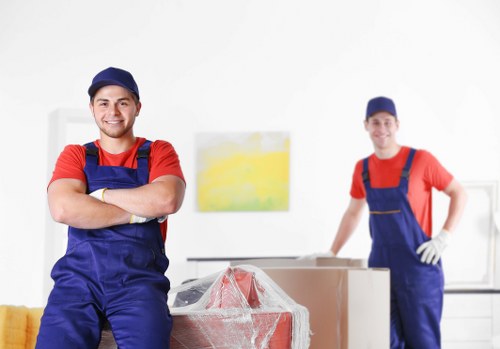 Professional moving team planning access and loading
