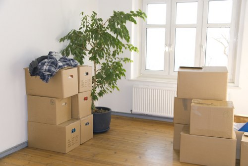 Boxes and furniture being loaded into a van for a local move
