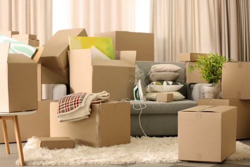 Professional movers loading furniture and boxes carefully