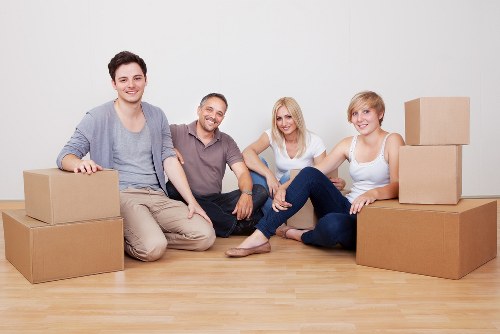 Boxes and furniture being loaded into a removal van